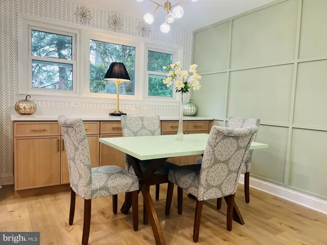 a dining room with furniture and window