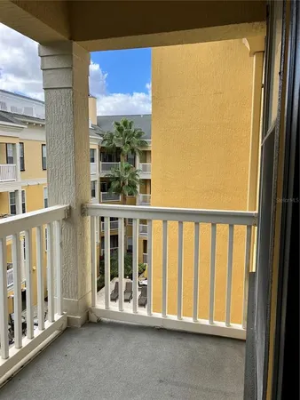 a view of an empty room with a large window