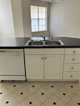 a kitchen with a sink and a cabinets
