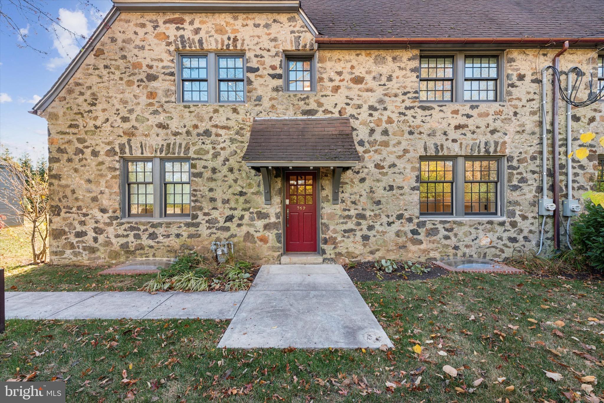767-769 Newtown Road Villanova, PA 19085 - Photo 3 of 26 a front view of a house with a yard