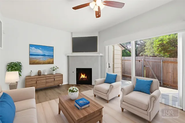 a living room with furniture and a fireplace