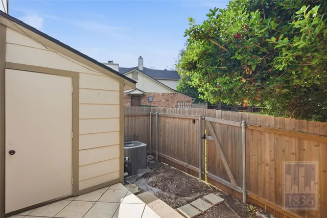 a view of a wooden fence