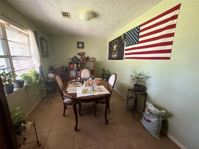 a kitchen with stainless steel appliances granite countertop a refrigerator stove and sink