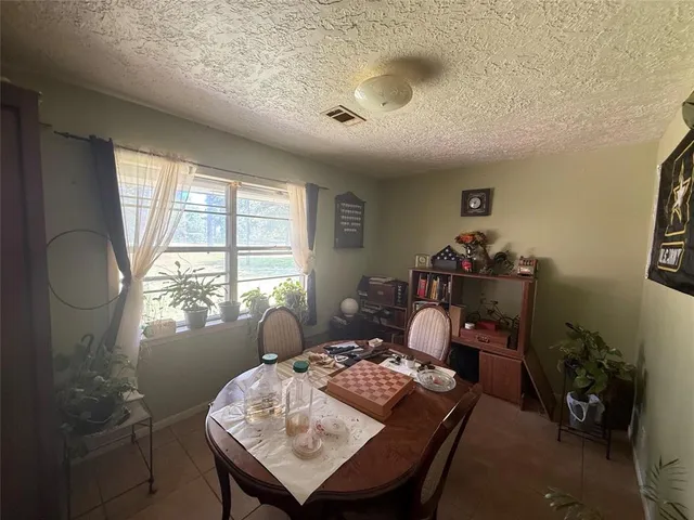 a view of a livingroom with furniture and a window