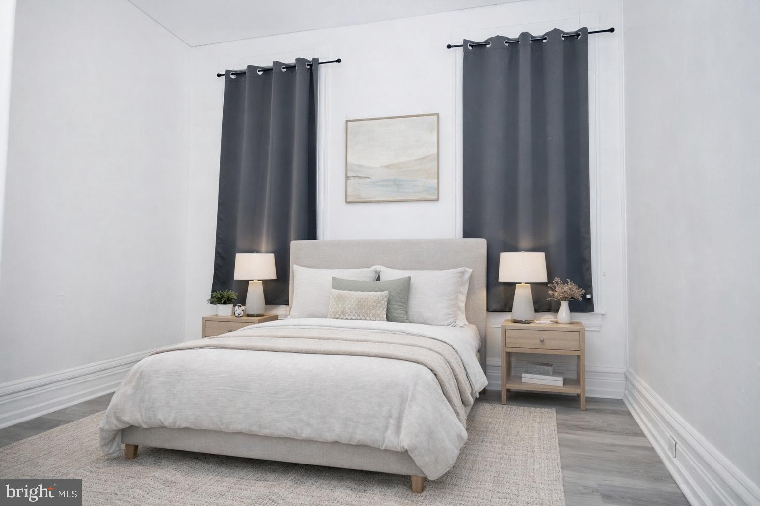 827 North 5th Street, Unit 1 Reading, PA 19601 - Photo 4 of 13 a bedroom with a bed and a window