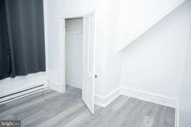 a kitchen with a refrigerator and a stove top oven