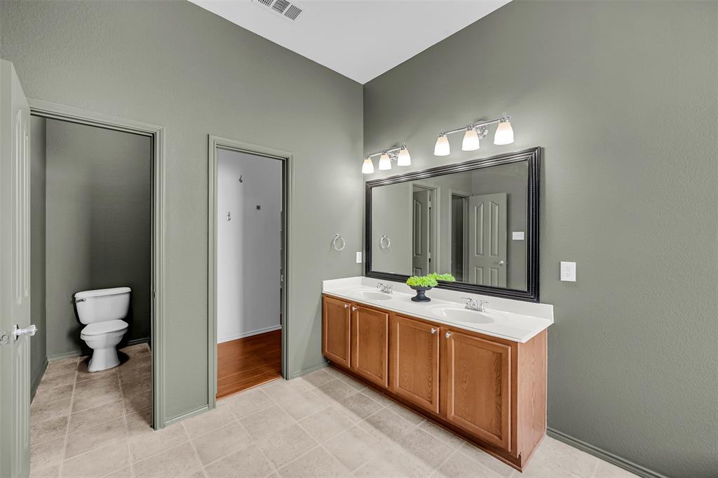 12109 Ridge Tree Road Fort Worth, TX 76036 - Photo 14 of 29 Bathroom featuring double vanity and light tile patterned flooring