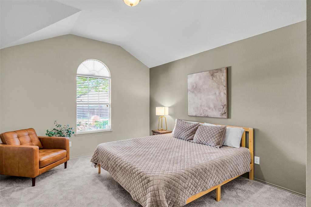 12109 Ridge Tree Road Fort Worth, TX 76036 - Photo 16 of 29 Bedroom with lofted ceiling and carpet floors