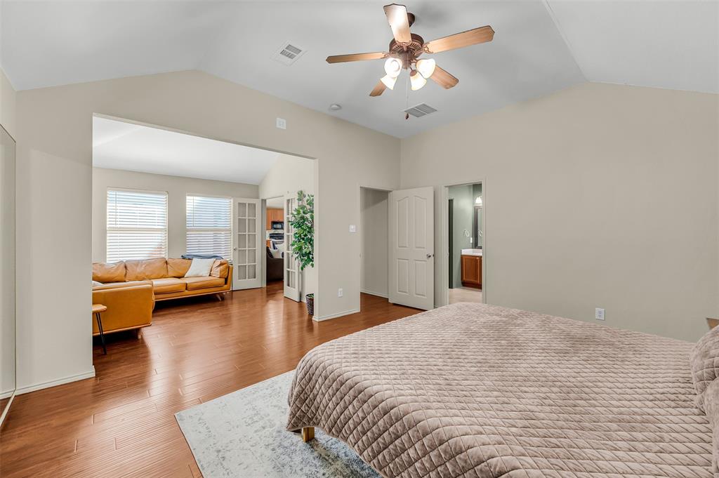 12109 Ridge Tree Road Fort Worth, TX 76036 - Photo 9 of 29 Bedroom featuring vaulted ceiling, a ceiling fan, and wood finished floors