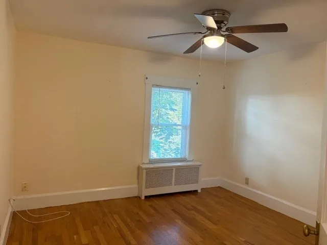 a bathroom with a toilet a sink and a mirror
