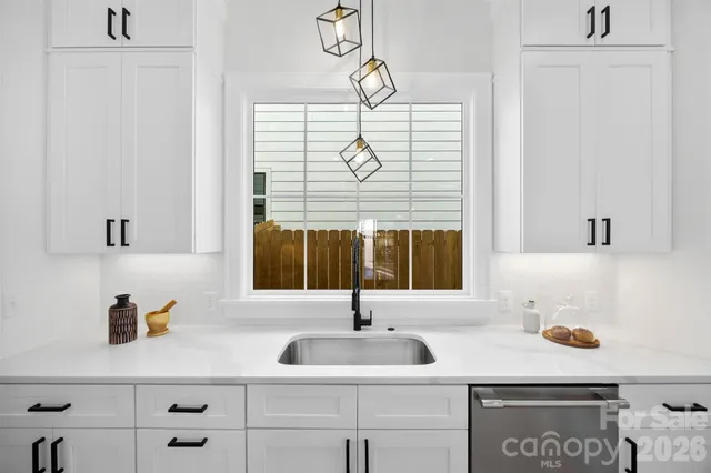 a bathroom with a sink and a window