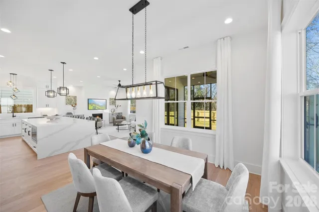 a view of a dining room with furniture and window