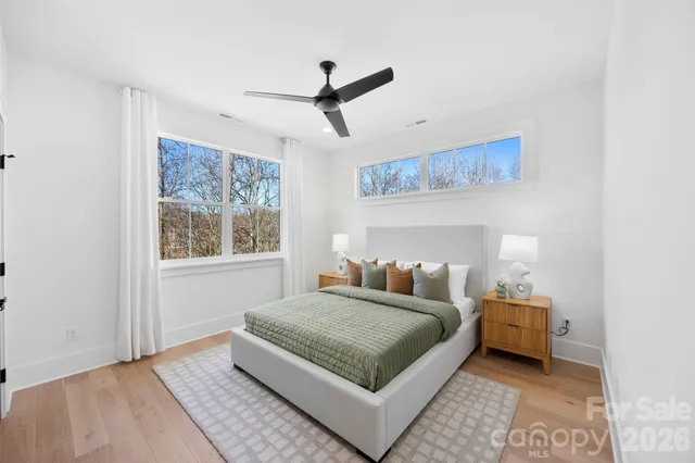 a bedroom with a bed and window