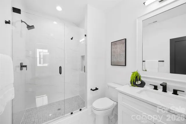 a bathroom with a bathtub and a toilet