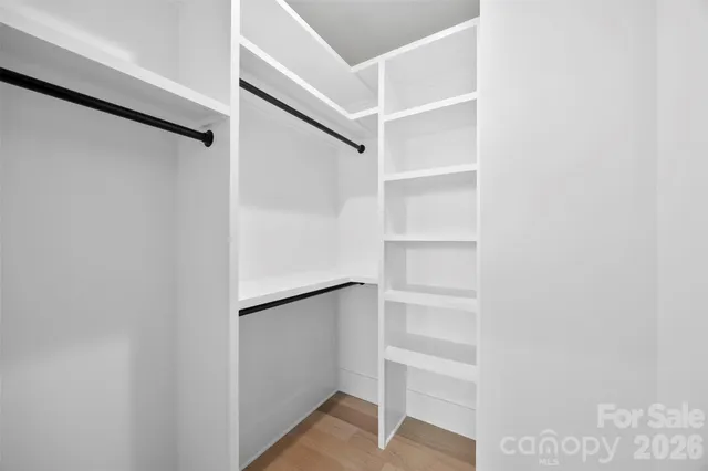 a bed room with a bed and a window