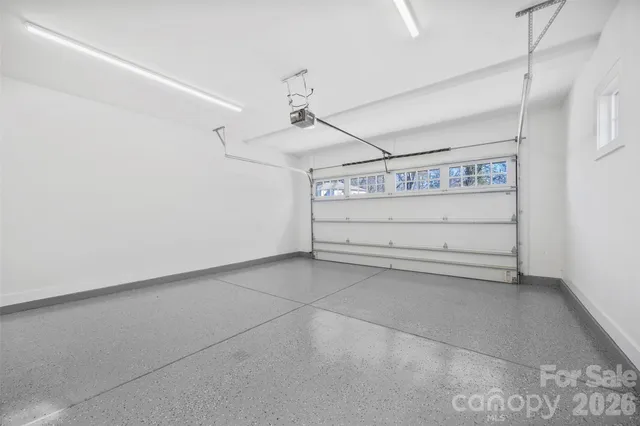 an aerial view of a house with yard