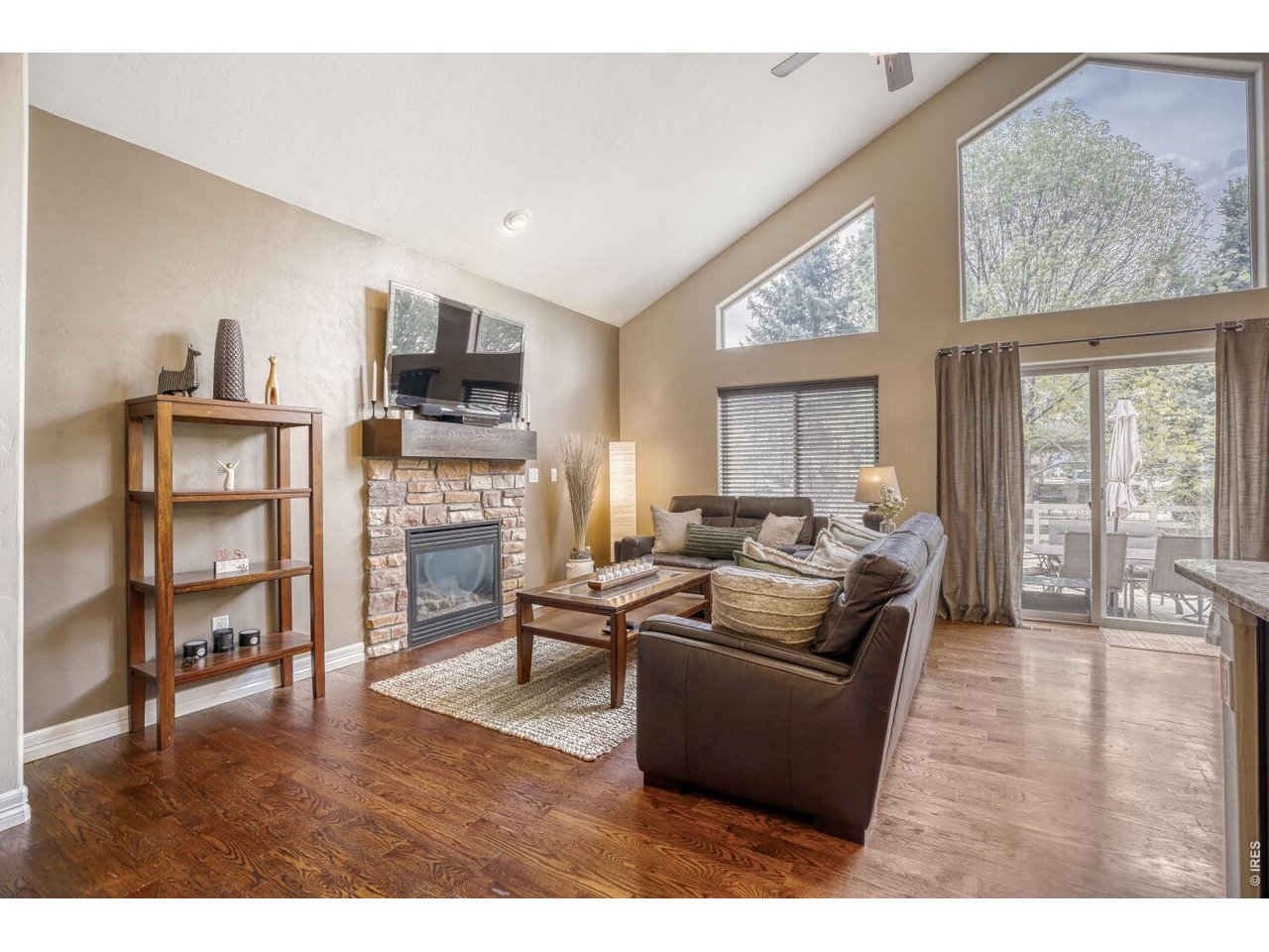 7992 St Street Frederick, CO 80530 - Photo 3 of 28 a living room with furniture wooden floor and a fireplace