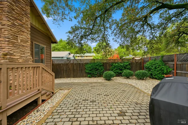 a view of a pathway with a wrought fence
