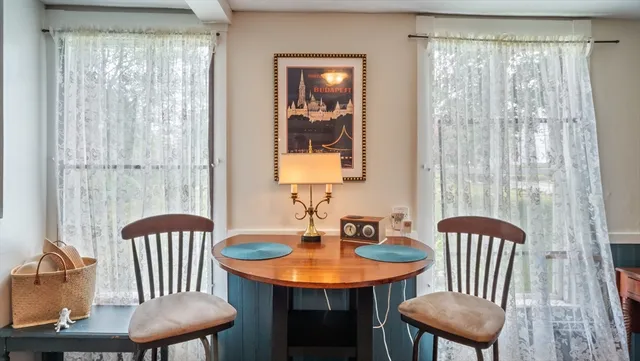 a view of a room with furniture and window