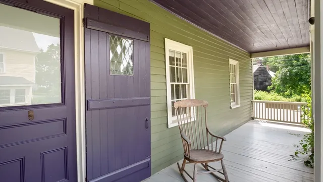 a view of a two chairs in the balcony