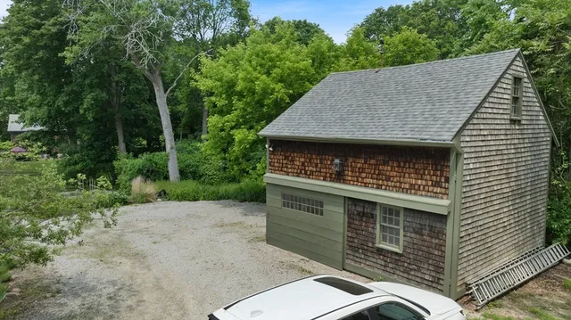 a aerial view of a house with a yard