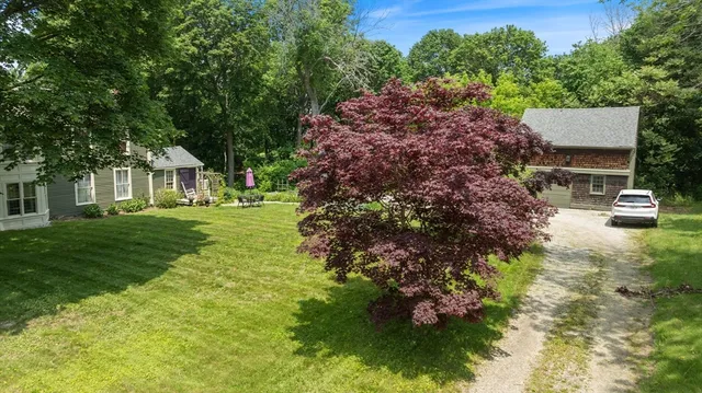 a backyard of a house with lots of green space