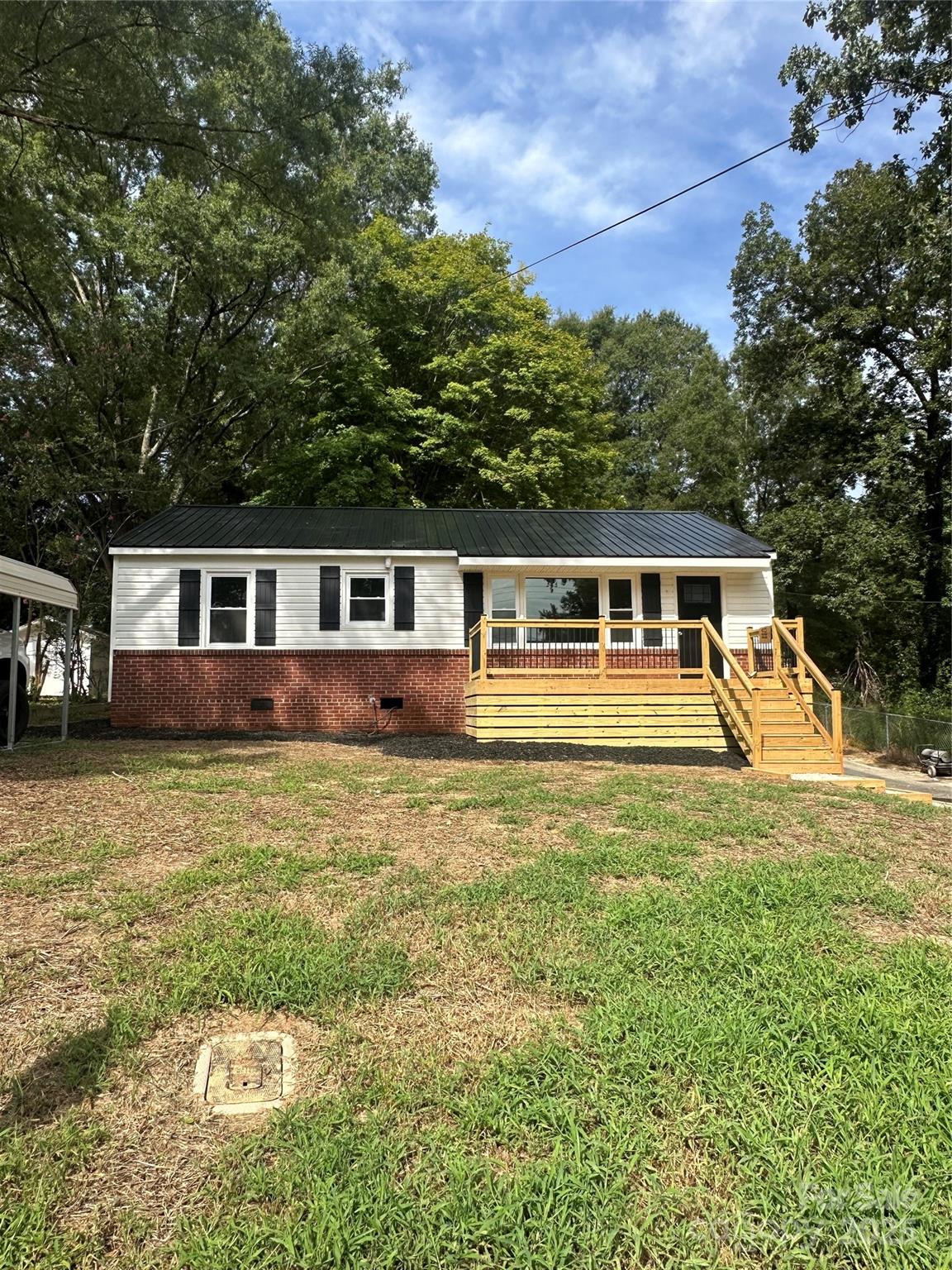 front view of a house with a big yard