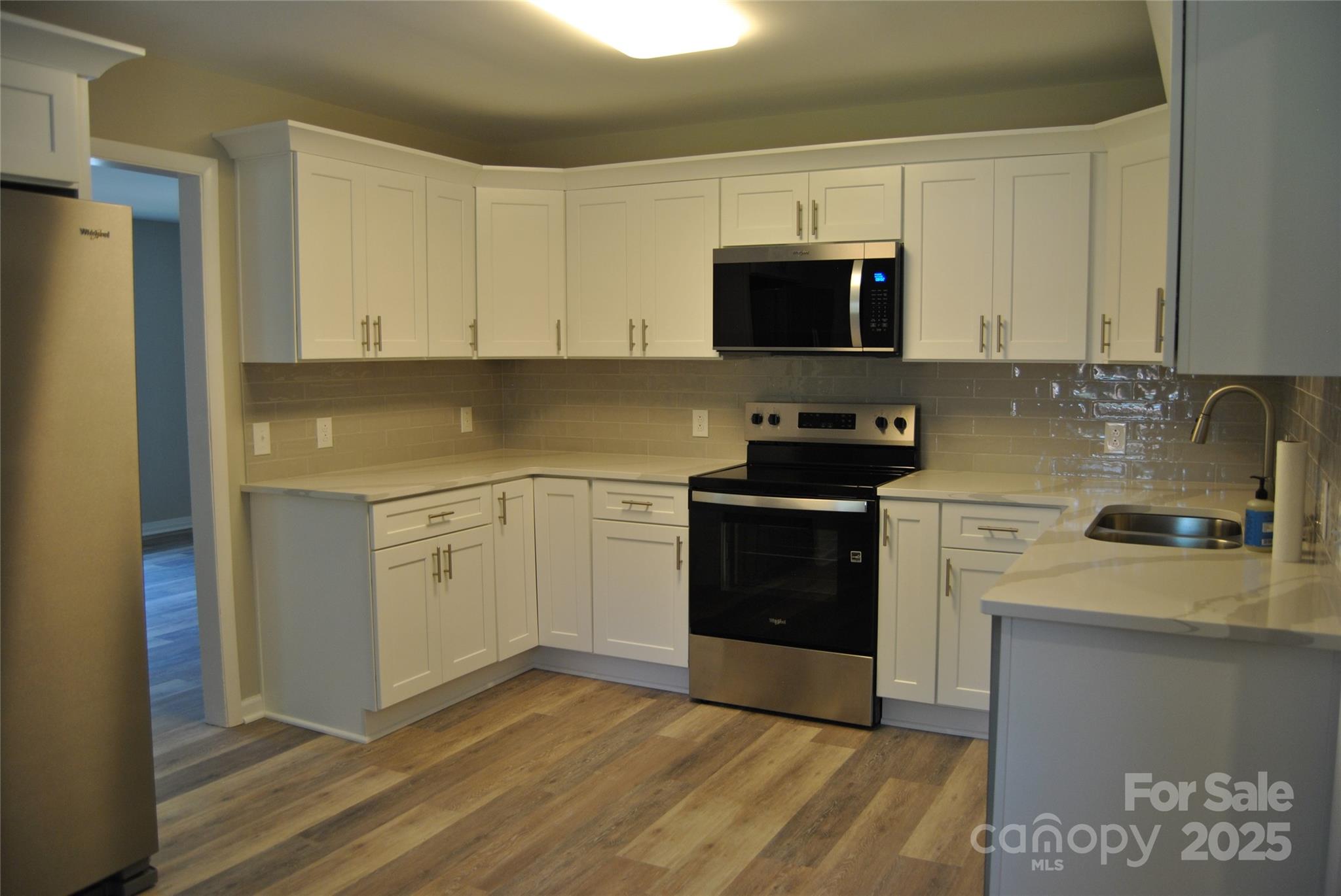 1737 Findlay Street Gastonia, NC 28052 - Photo 12 of 35 a kitchen with a sink stove and microwave