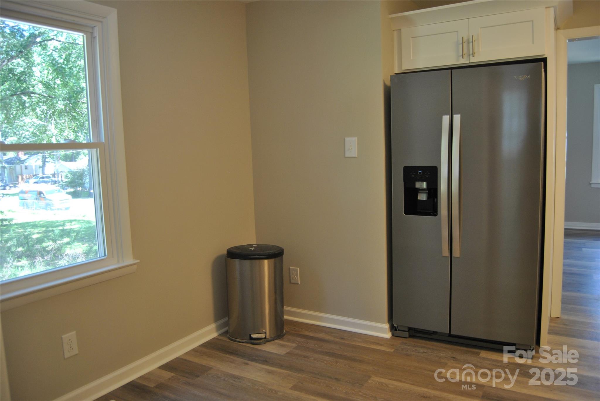 1737 Findlay Street Gastonia, NC 28052 - Photo 14 of 35 a view of an empty room with wooden floor and a window