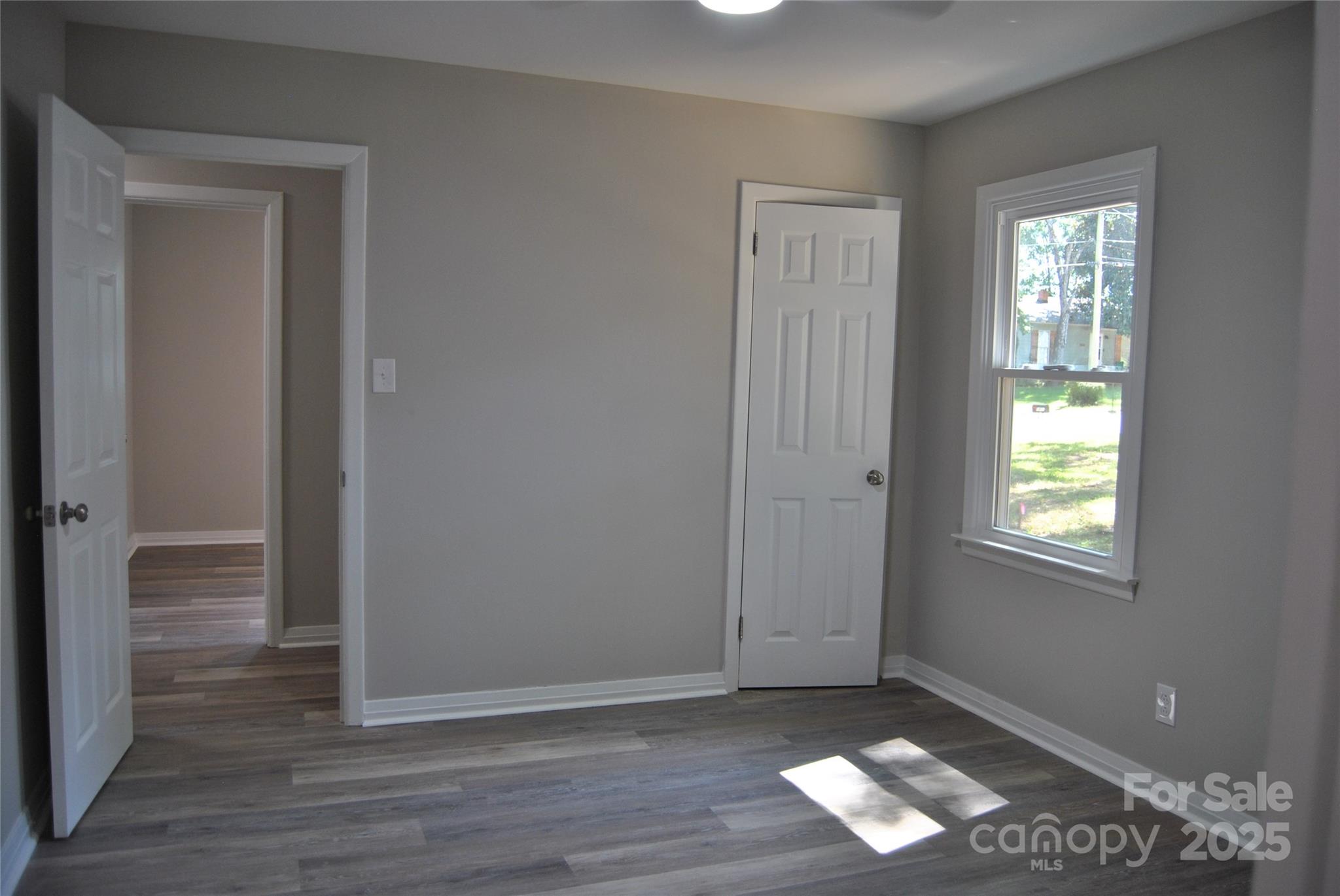 1737 Findlay Street Gastonia, NC 28052 - Photo 17 of 35 a view of empty room with wooden floor and fan