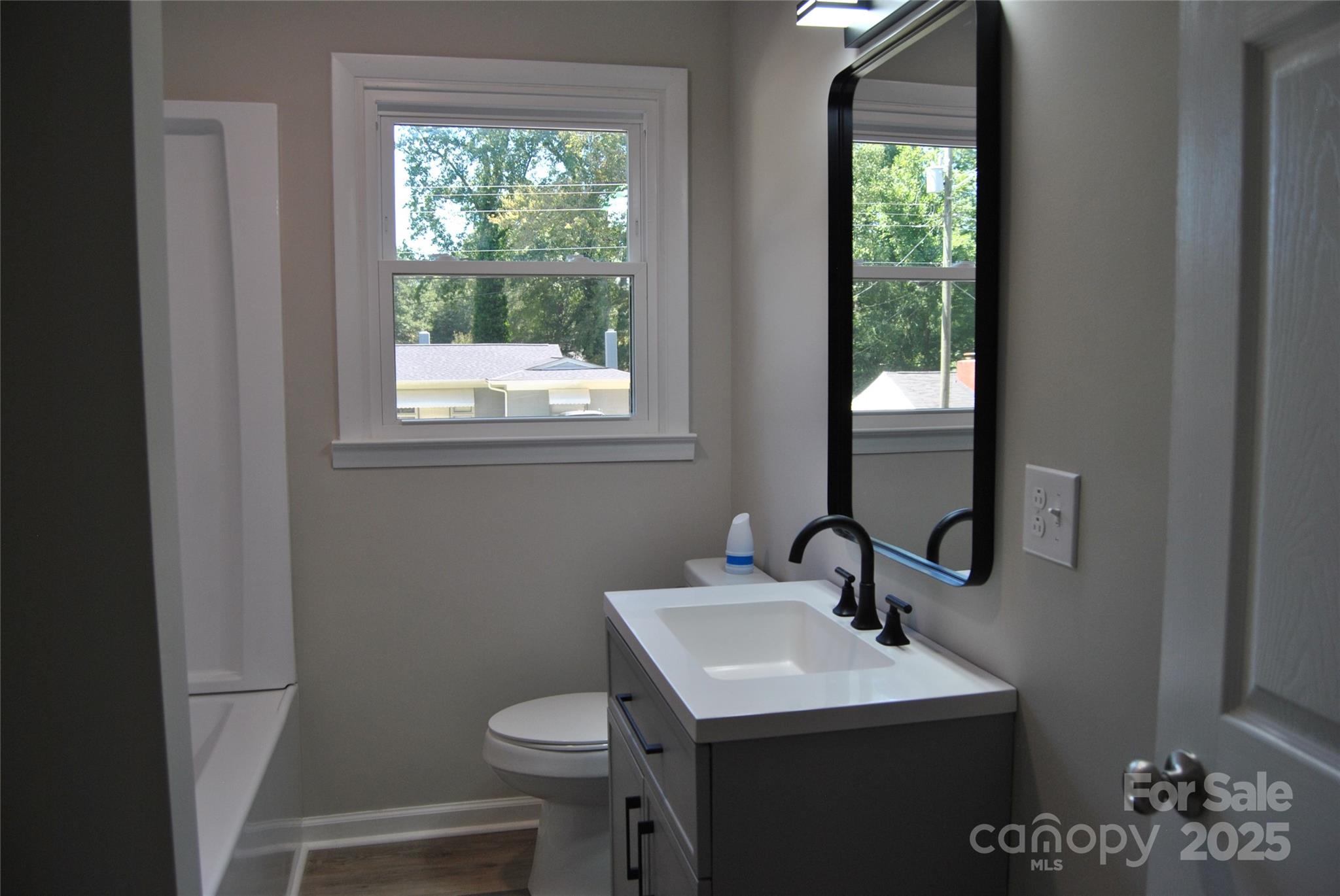 1737 Findlay Street Gastonia, NC 28052 - Photo 25 of 35 a bathroom with a sink toilet and a mirror