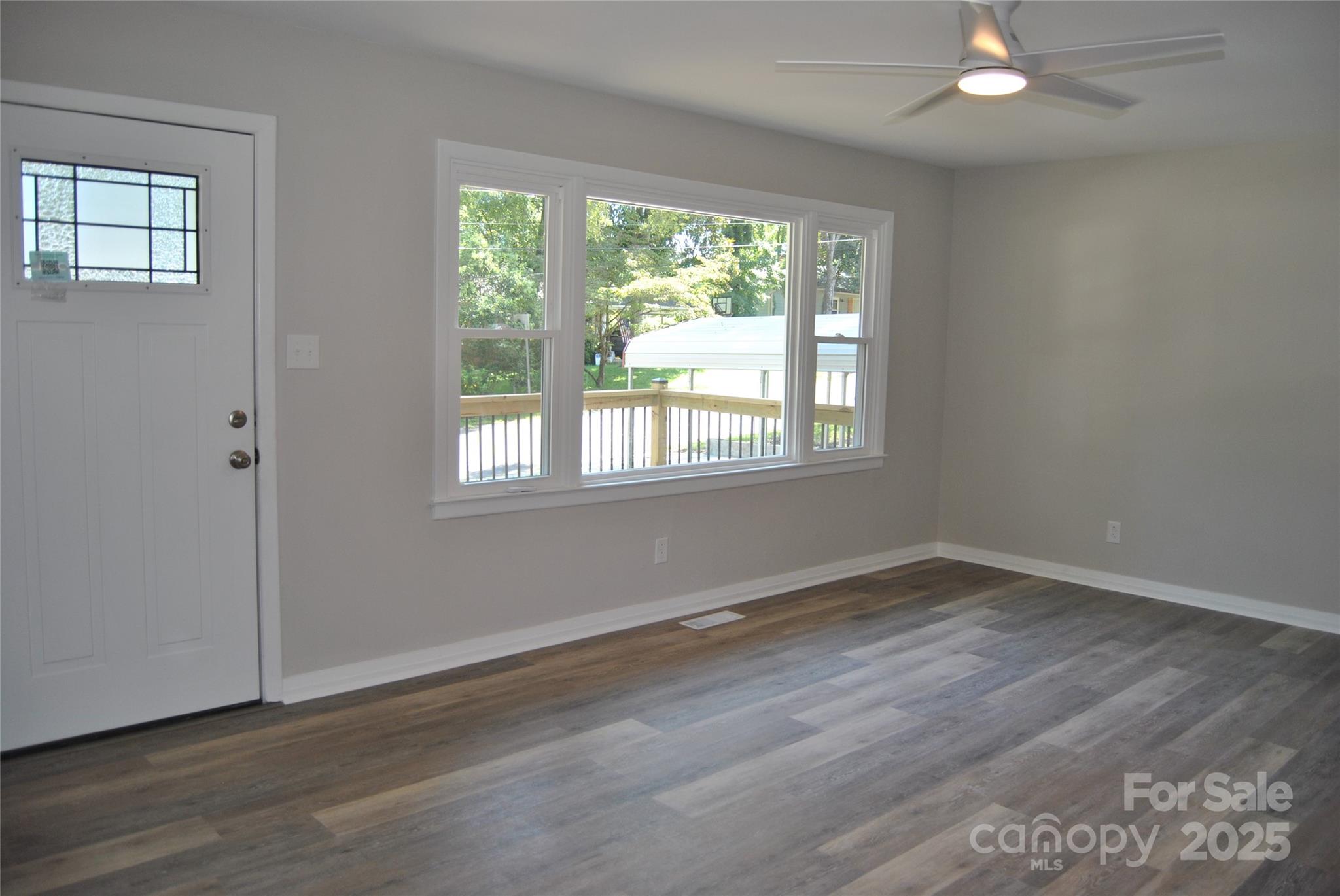 1737 Findlay Street Gastonia, NC 28052 - Photo 6 of 35 an empty room with wooden floor and windows