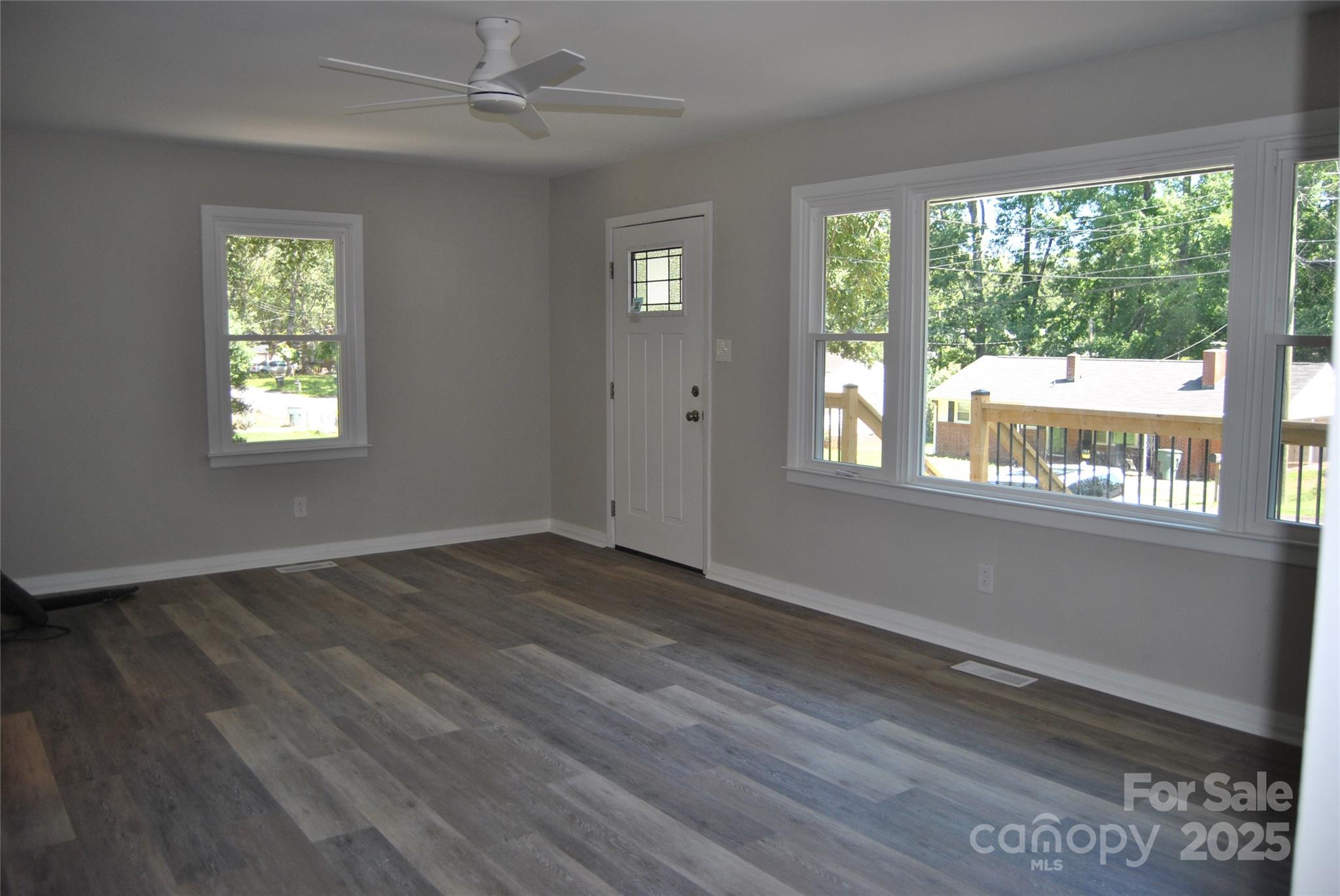 1737 Findlay Street Gastonia, NC 28052 - Photo 8 of 35 a view of an empty room with wooden floor and a window