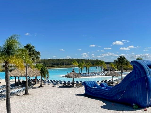 9610 Rally Spring Loop Wesley Chapel, FL 33545 - Photo 36 of 38 a view of a terrace with outdoor seating and water view