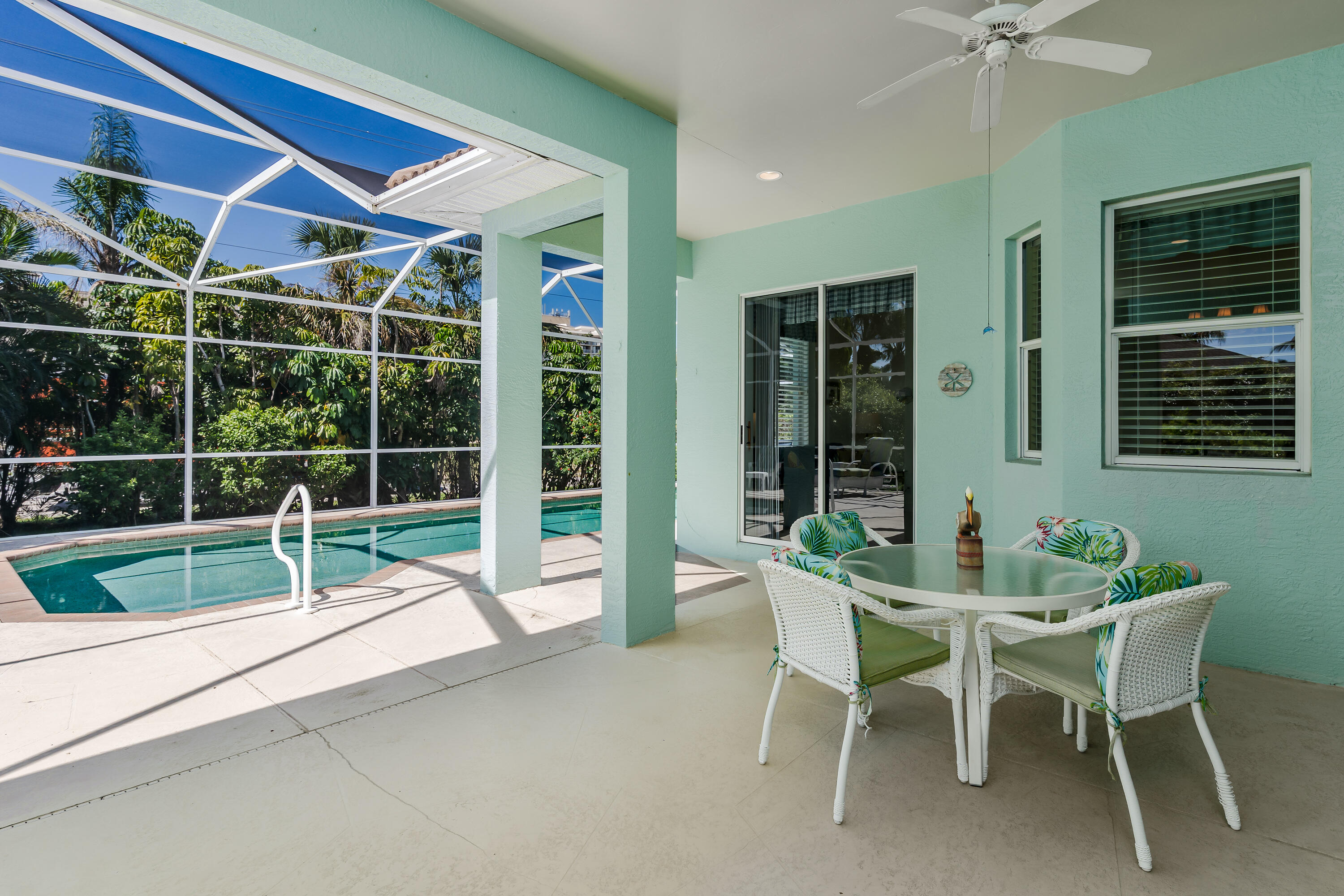 951 Java Court Marco Island, FL 34145 - Photo 11 of 55 a wooden bench sitting in front of a building