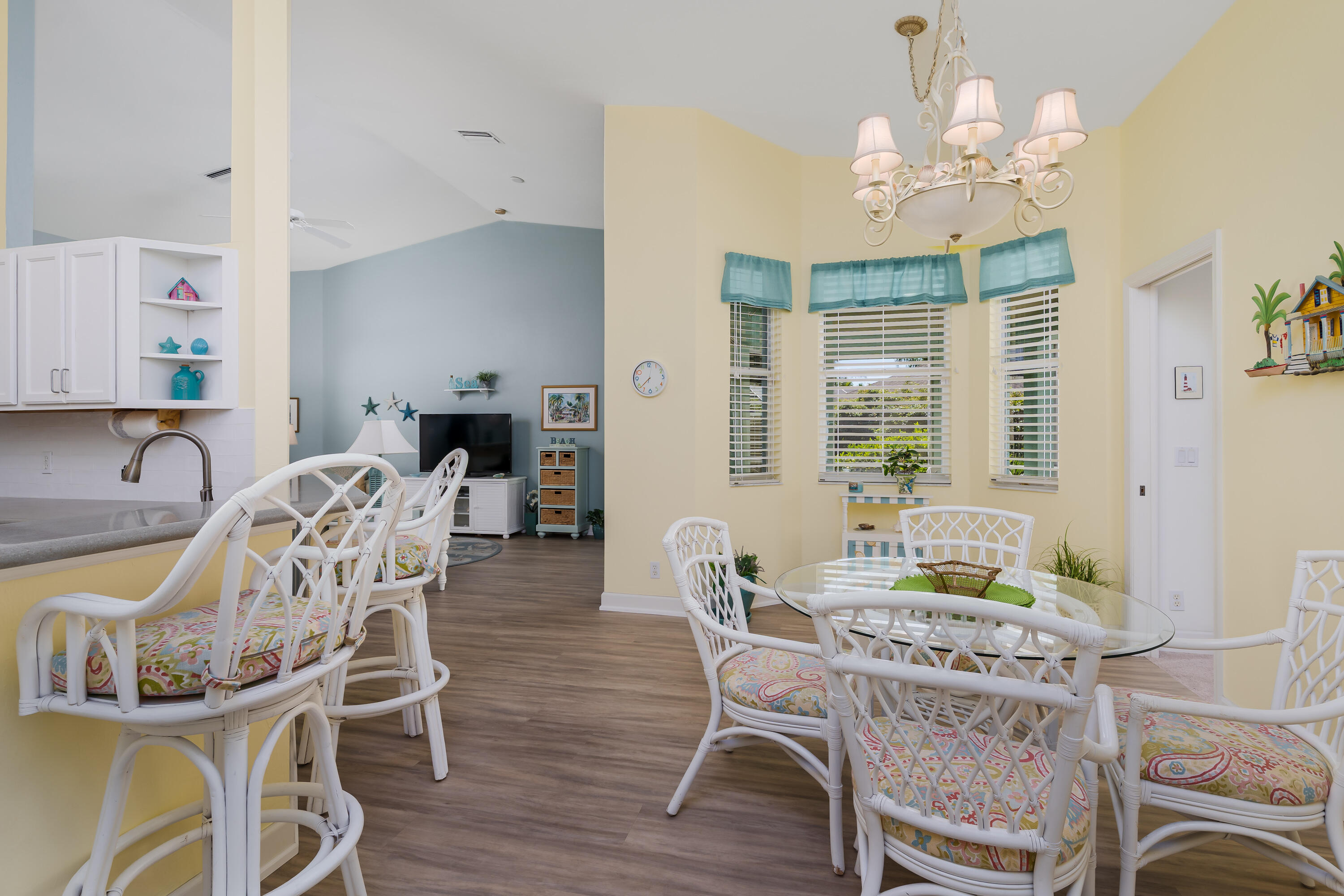 951 Java Court Marco Island, FL 34145 - Photo 18 of 55 a view of a dining room with furniture a chandelier and wooden floor