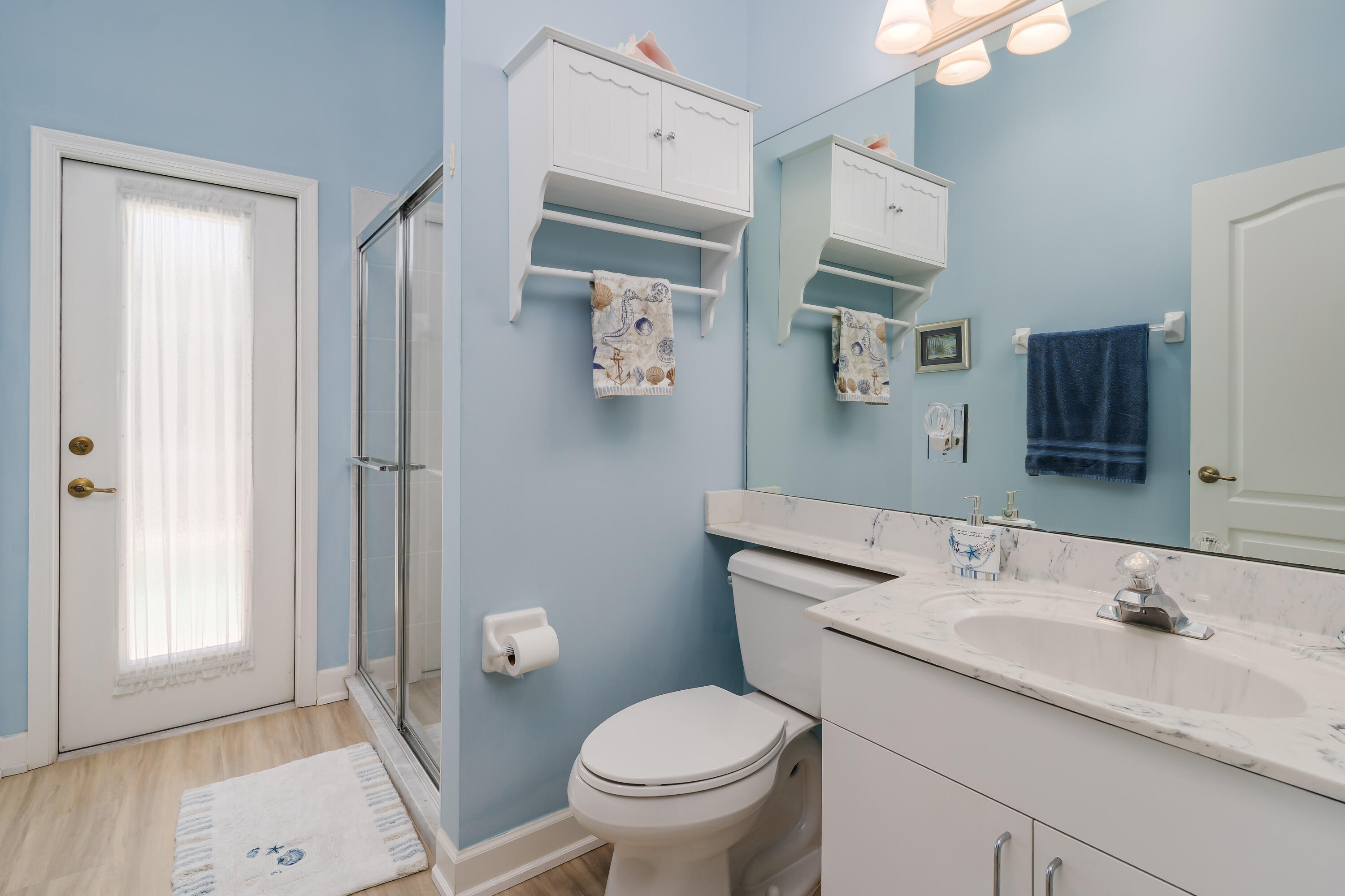 951 Java Court Marco Island, FL 34145 - Photo 23 of 55 a bathroom with a granite countertop toilet a sink and a mirror