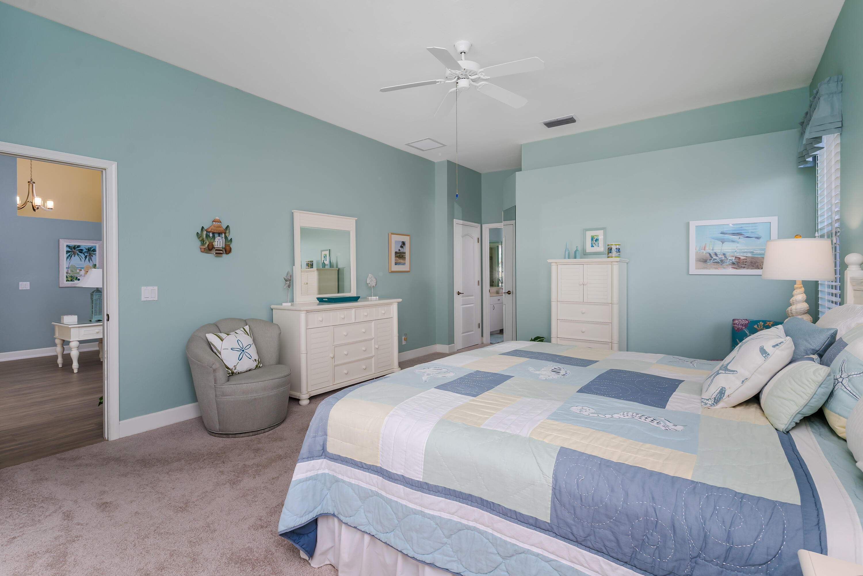 951 Java Court Marco Island, FL 34145 - Photo 25 of 55 a bedroom with a bed and a chandelier