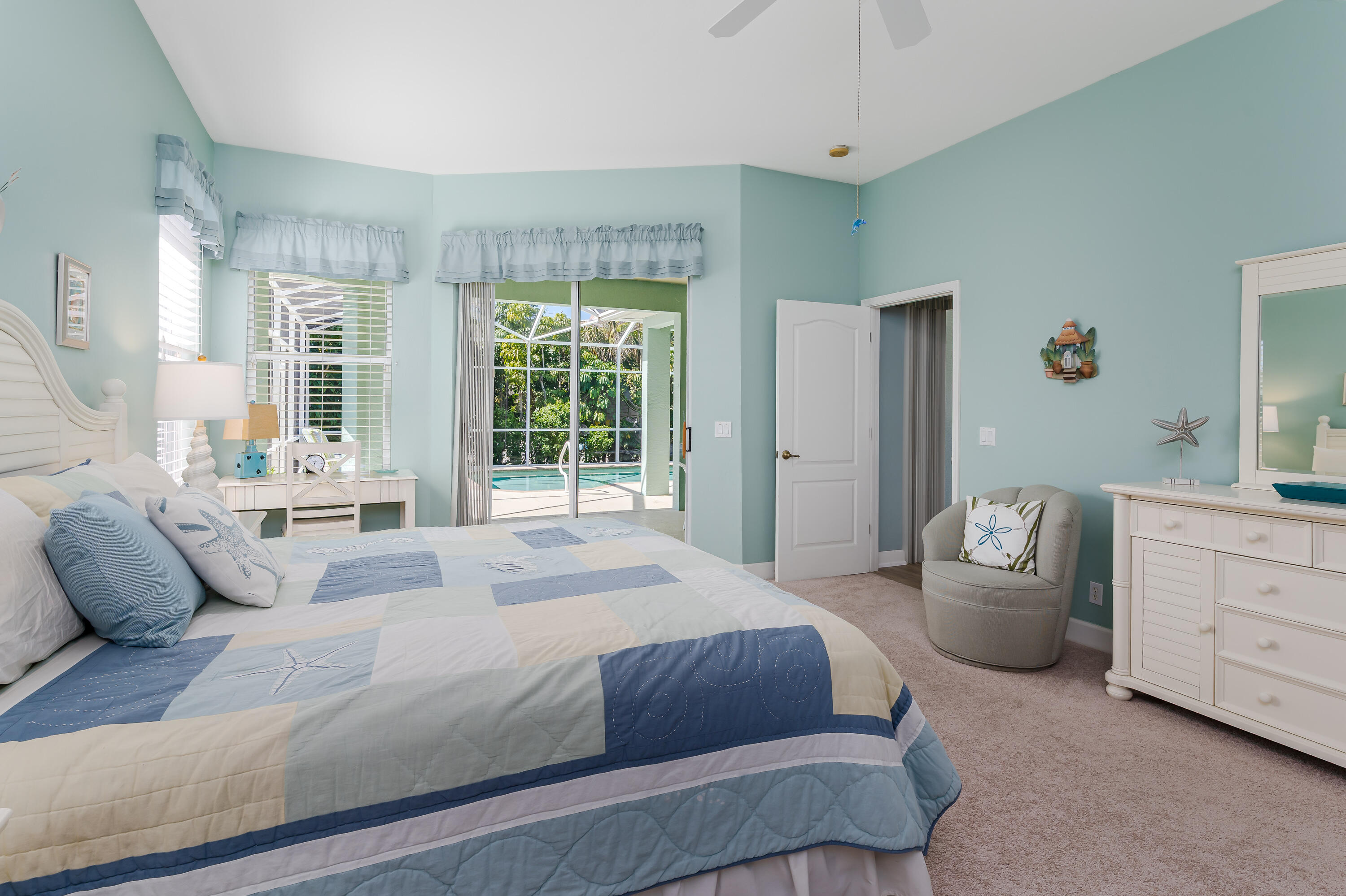 951 Java Court Marco Island, FL 34145 - Photo 27 of 55 a bedroom with a balcony a bed and furniture