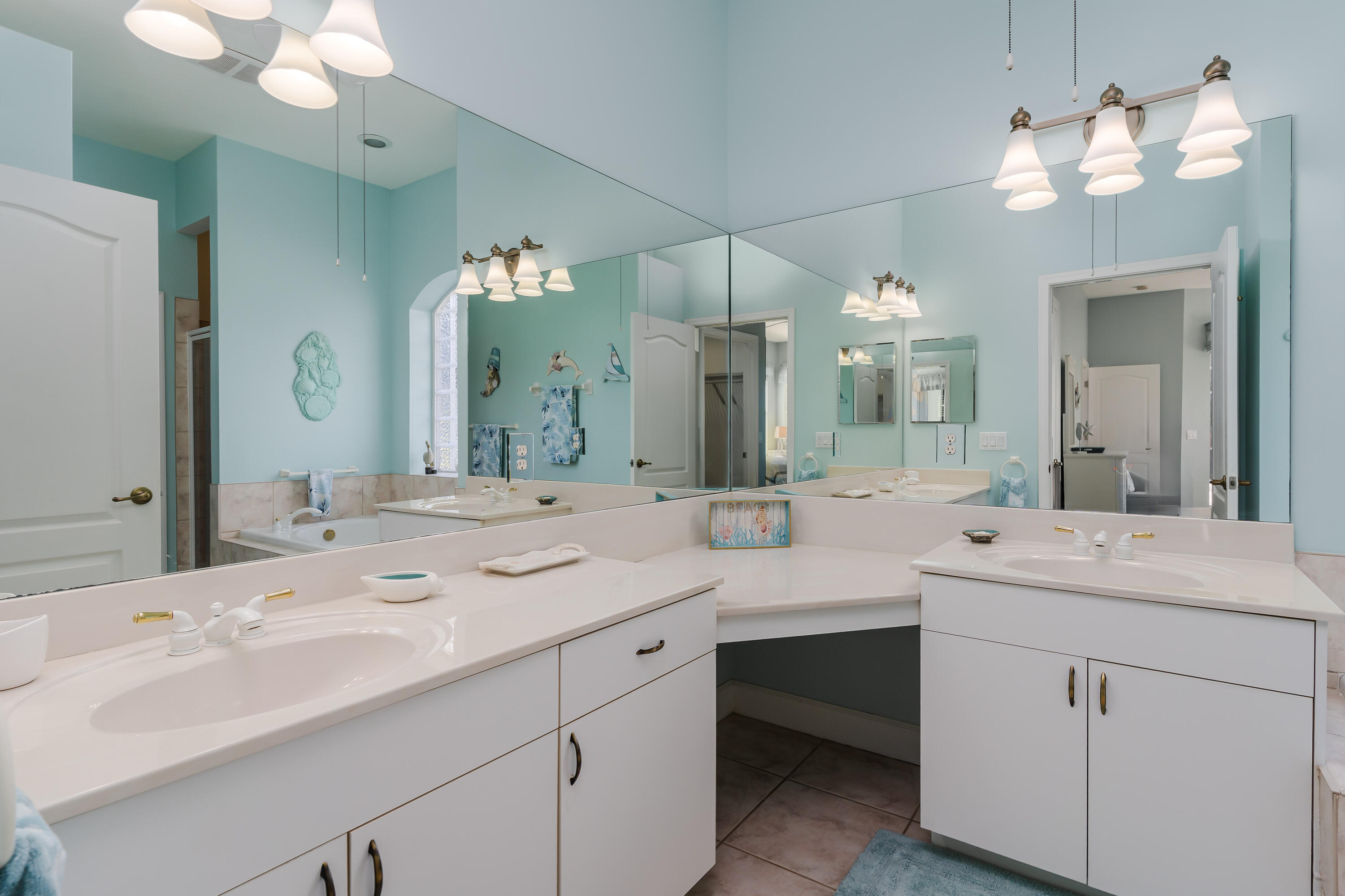 951 Java Court Marco Island, FL 34145 - Photo 29 of 55 a view with double vanity sink and a mirror