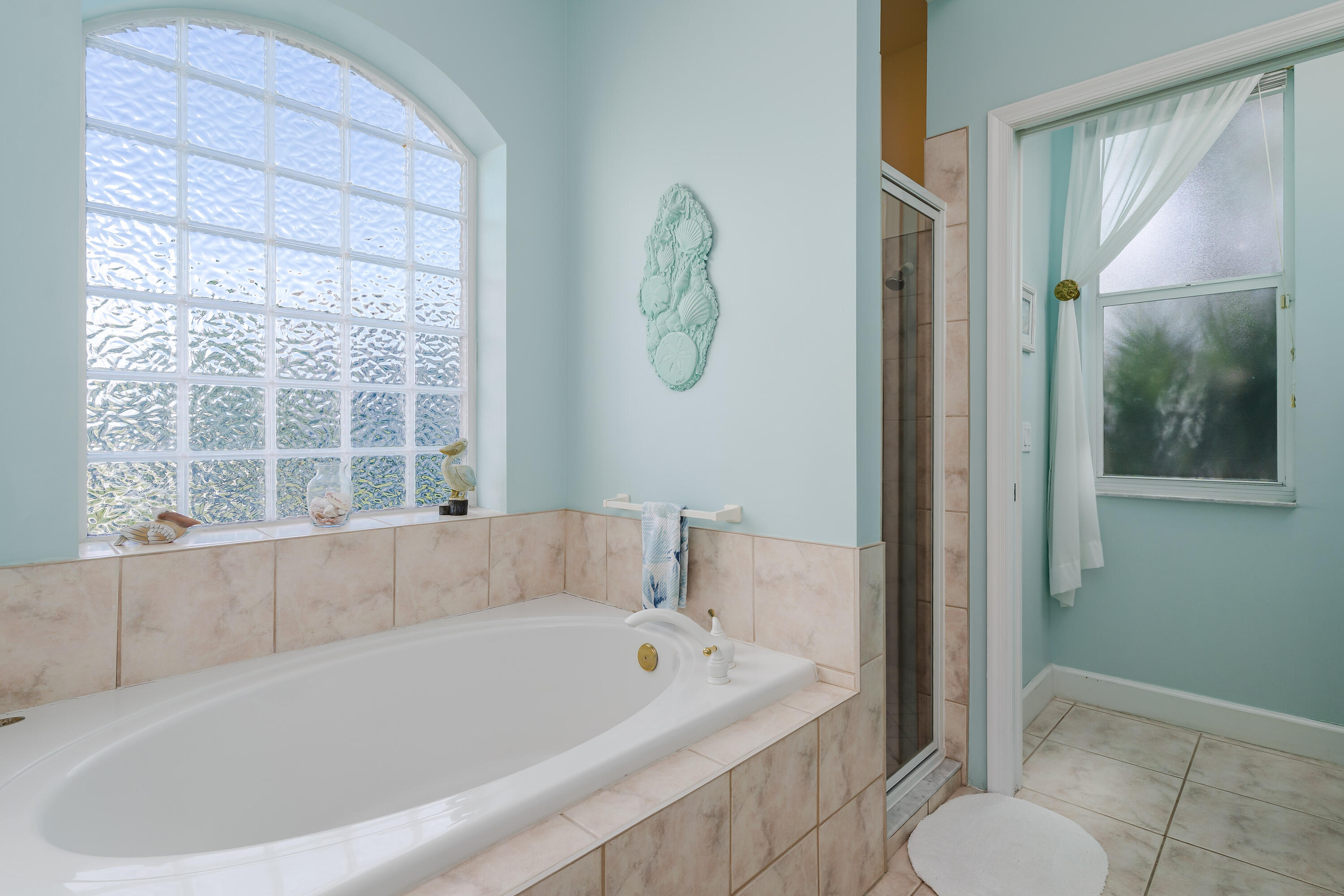 951 Java Court Marco Island, FL 34145 - Photo 30 of 55 a bathroom with a tub shower and toilet