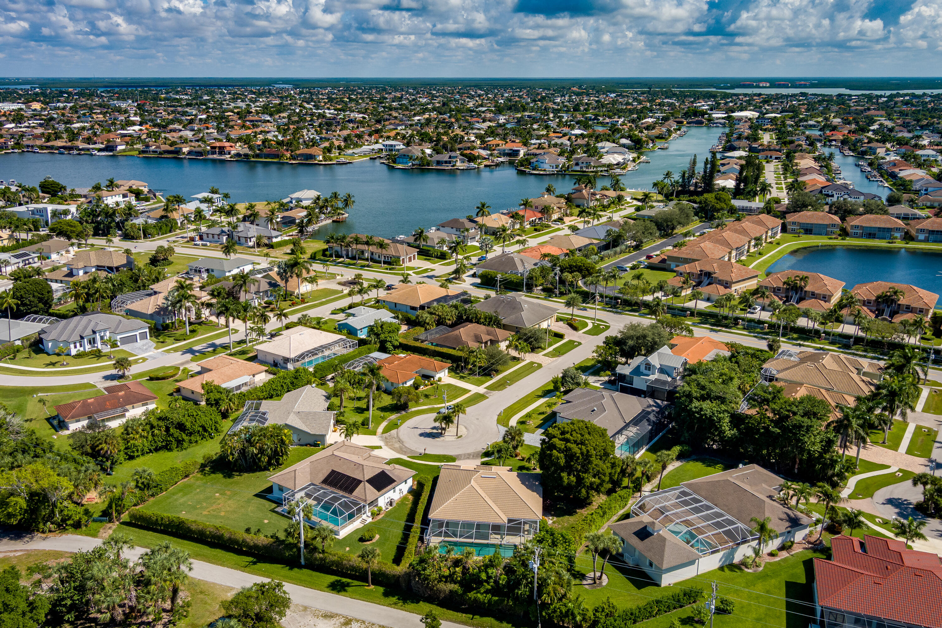 951 Java Court Marco Island, FL 34145 - Photo 50 of 55 an aerial view of a residential building and lake view