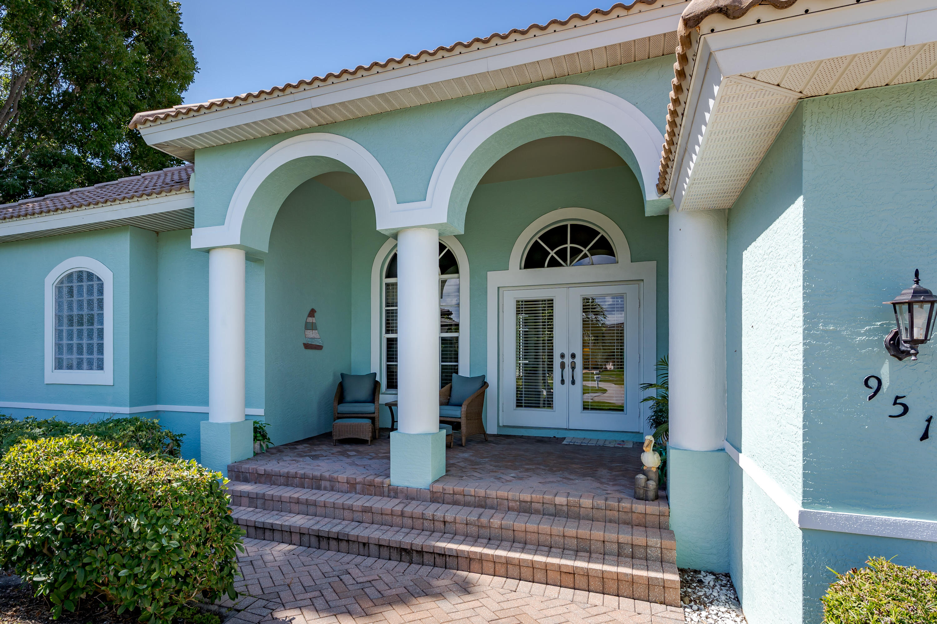 951 Java Court Marco Island, FL 34145 - Photo 5 of 55 a front view of a house with garden