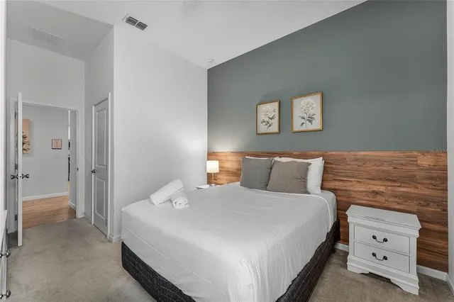 a bedroom with a bed and window