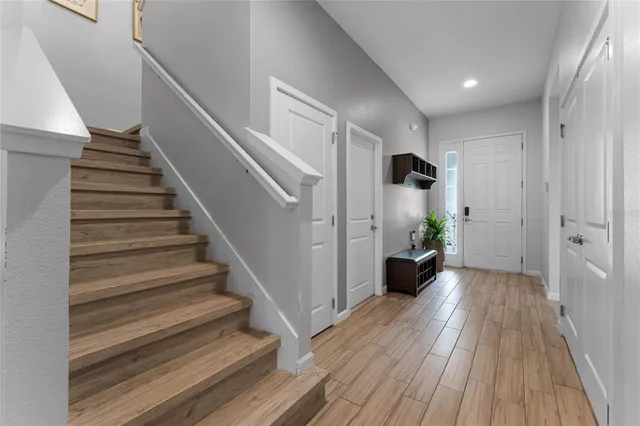 a large kitchen with a table and chairs