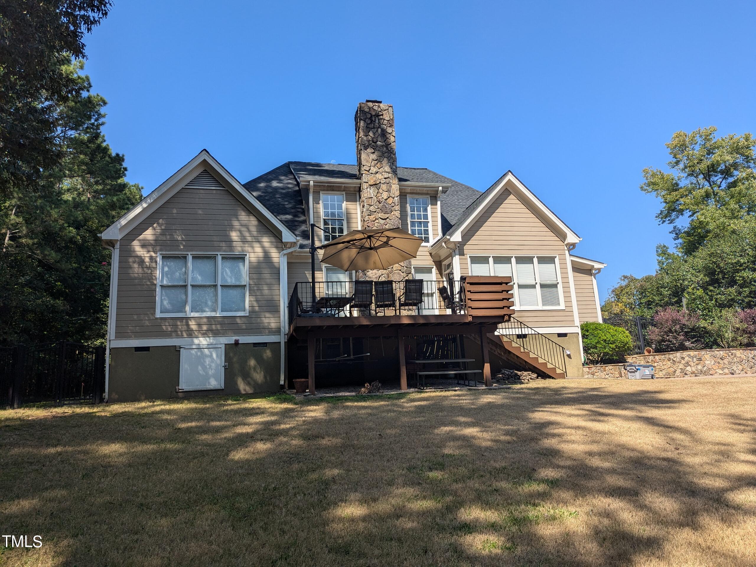 151 Michael Way Clayton, NC 27520 - Photo 18 of 36 a front view of a house with a yard and garage