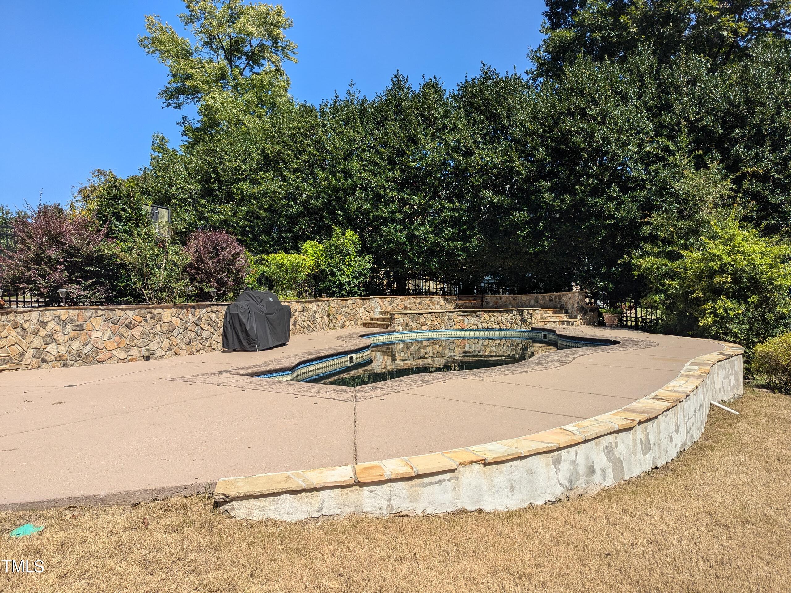 151 Michael Way Clayton, NC 27520 - Photo 19 of 36 a view of a swimming pool with a yard