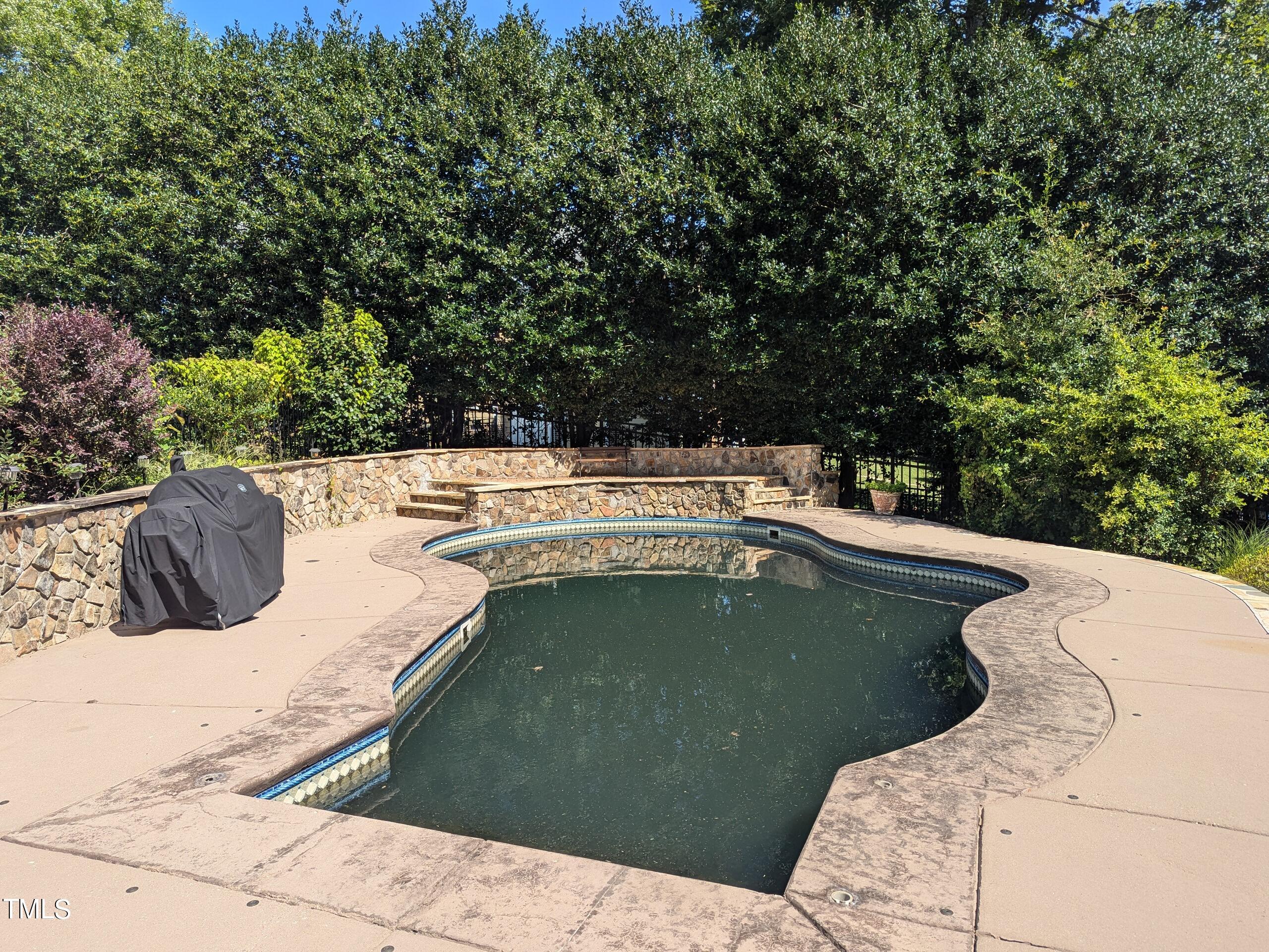 151 Michael Way Clayton, NC 27520 - Photo 20 of 36 a view of a swimming pool with a yard