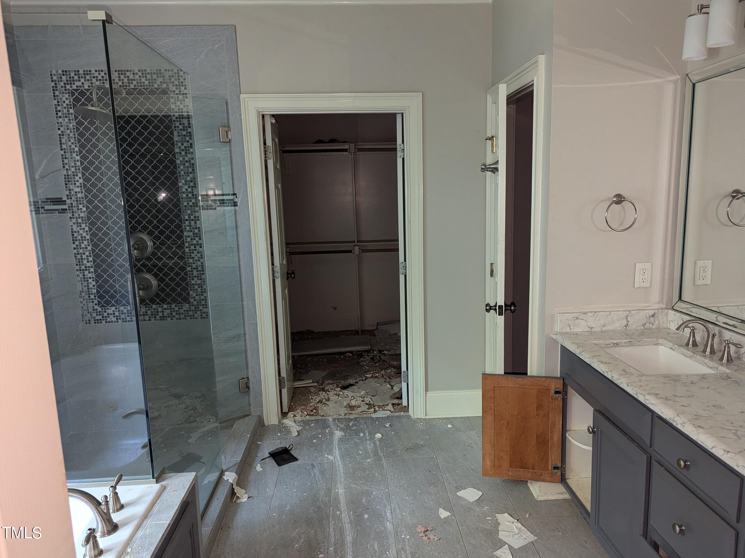 151 Michael Way Clayton, NC 27520 - Photo 23 of 36 a bathroom with a granite countertop shower mirror and a sink