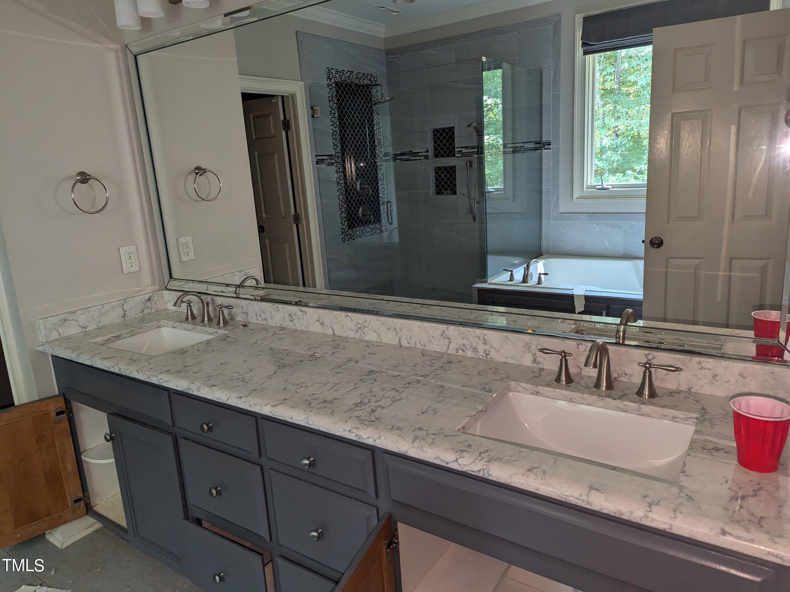 151 Michael Way Clayton, NC 27520 - Photo 24 of 36 a bathroom with a granite countertop sink and a mirror